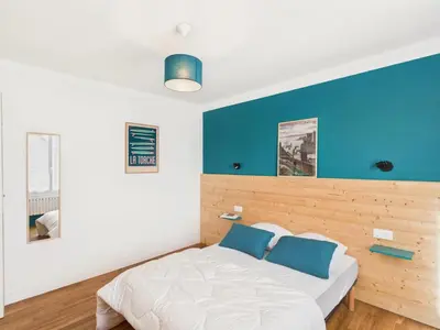 Un ou plusieurs lits dans un hébergement de l'établissement À 200m de la plage de Langoz - Maison pour 10