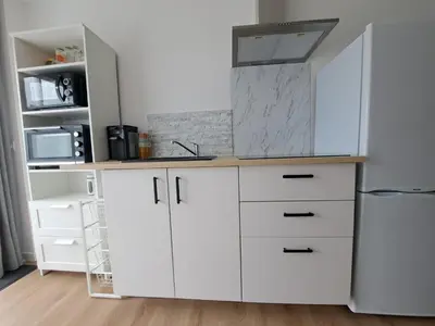 Cuisine ou kitchenette dans l'établissement Studio Pleuven