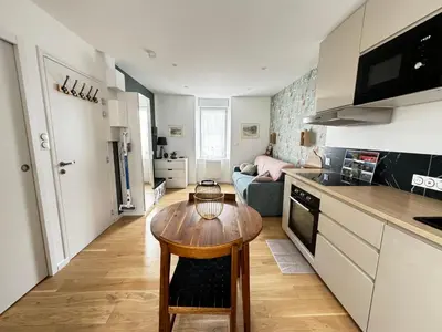 Cuisine ou kitchenette dans l'établissement Studio confortable