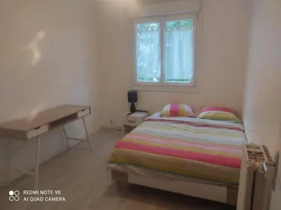 Un ou plusieurs lits dans un hébergement de l'établissement Appartement T4