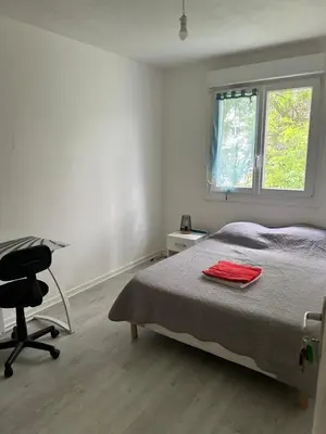 Un ou plusieurs lits dans un hébergement de l'établissement Appartement T4
