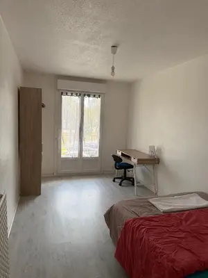 Un ou plusieurs lits dans un hébergement de l'établissement Appartement T4