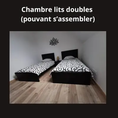 Un ou plusieurs lits dans un hébergement de l'établissement * Ty cocon * wifi * parking * moderne *