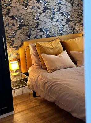 Un ou plusieurs lits dans un hébergement de l'établissement L Appartement - Siam vue Capucins