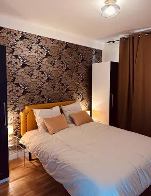 Un ou plusieurs lits dans un hébergement de l'établissement L Appartement - Siam vue Capucins