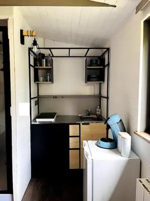 Cuisine ou kitchenette dans l'établissement Chalet des Fées - Piscine