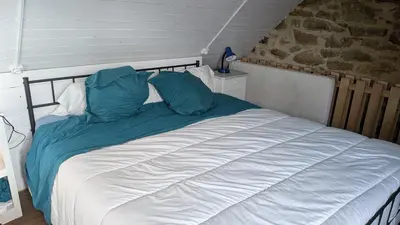 Un ou plusieurs lits dans un hébergement de l'établissement L'Ankou guest house