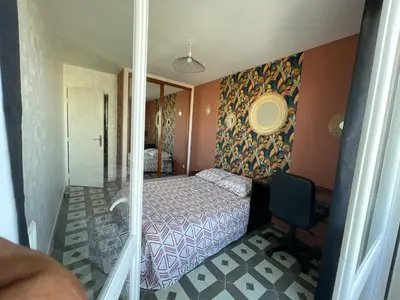 Un ou plusieurs lits dans un hébergement de l'établissement Chambre proche commerce et université 1