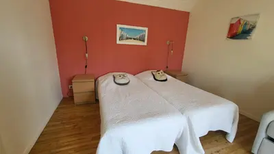 Un ou plusieurs lits dans un hébergement de l'établissement L'ESCAPADE BIGOUDENE - maison 300m de la plage