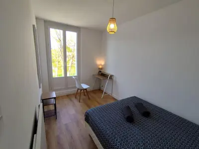 Un ou plusieurs lits dans un hébergement de l'établissement Le Pic vert By Nid'Ouest 3 Chambres