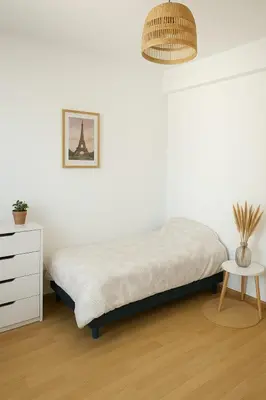 Un ou plusieurs lits dans un hébergement de l'établissement Appartement spacieux de 92m2
