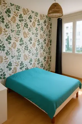 Un ou plusieurs lits dans un hébergement de l'établissement Appartement spacieux de 92m2