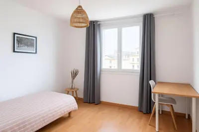 Un ou plusieurs lits dans un hébergement de l'établissement Appartement spacieux de 92m2