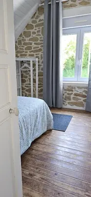 Un ou plusieurs lits dans un hébergement de l'établissement Jolie maison avec vue mer imprenable proche plage