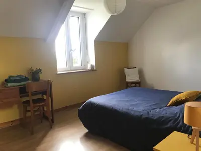 Un ou plusieurs lits dans un hébergement de l'établissement La Guillerette, authentique longère bretonne