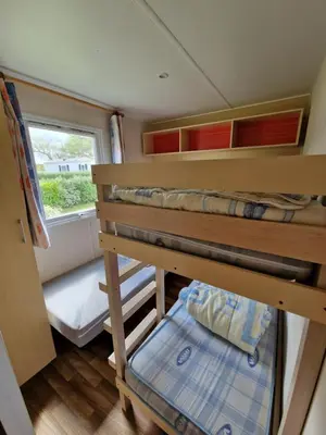 Un ou plusieurs lits dans un hébergement de l'établissement Mobil home plouescat