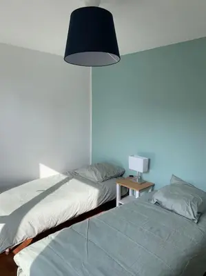 Un ou plusieurs lits dans un hébergement de l'établissement Ty Reuz - Maison avec 40 m2 de terrasse vue mer à Morgat