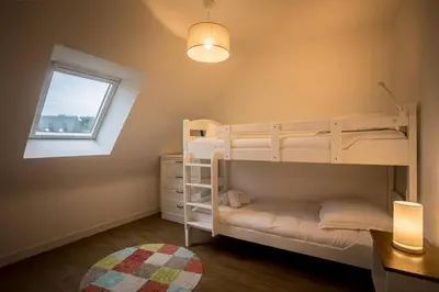 Un ou plusieurs lits dans un hébergement de l'établissement Ty Ewano, vue mer