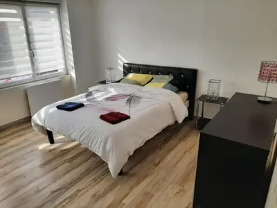 Un ou plusieurs lits dans un hébergement de l'établissement Appart cosy aux écluses du port