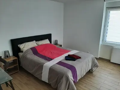 Un ou plusieurs lits dans un hébergement de l'établissement Appart cosy aux écluses du port