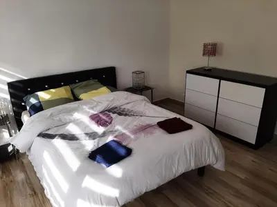 Un ou plusieurs lits dans un hébergement de l'établissement Appart cosy aux écluses du port