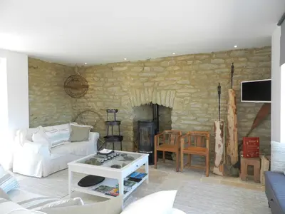 Coin salon dans l'établissement Holiday Home Le Ménez by Interhome