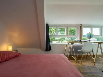 Un ou plusieurs lits dans un hébergement de l'établissement Holiday Home Ty Louen by Interhome