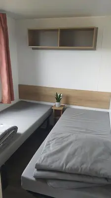 Un ou plusieurs lits dans un hébergement de l'établissement Mobil-home vue mer et campagne