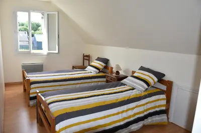 Un ou plusieurs lits dans un hébergement de l'établissement MAISON à la campagne à LENNON
