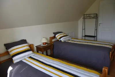 Un ou plusieurs lits dans un hébergement de l'établissement MAISON à la campagne à LENNON