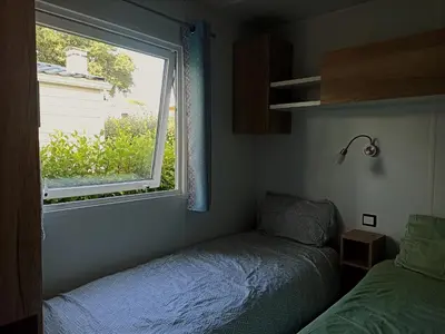 Un ou plusieurs lits dans un hébergement de l'établissement Mobil home dans Camping 4 étoiles