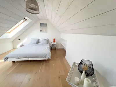 Un ou plusieurs lits dans un hébergement de l'établissement Jolie maison de vacances à 5 mn à pied des plages