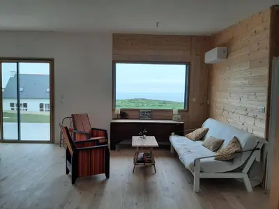 Coin salon dans l'établissement Maison en bois vue sur mer en Bretagne 5 couchages