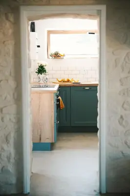 Cuisine ou kitchenette dans l'établissement La Chaumière Loctudy - Vue Mer - Accès direct Plage