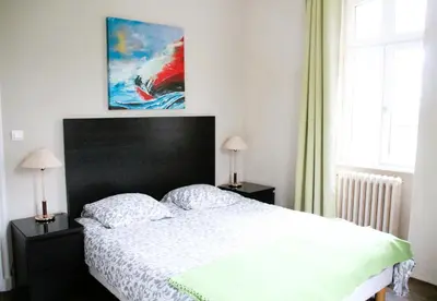 Un ou plusieurs lits dans un hébergement de l'établissement La Maison du Port, vue mer, jardin et parking