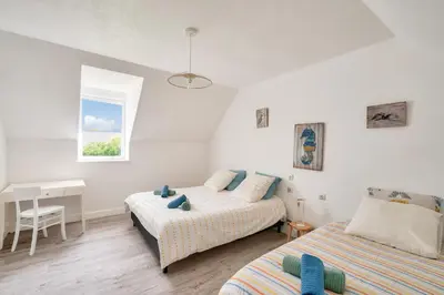 Un ou plusieurs lits dans un hébergement de l'établissement Belle maison pour 7 à 300m de la plage au Guilvinec