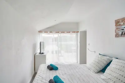 Un ou plusieurs lits dans un hébergement de l'établissement Belle maison pour 7 à 300m de la plage au Guilvinec