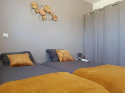 Un ou plusieurs lits dans un hébergement de l'établissement La Maison du Lividig 3 étoiles OT29