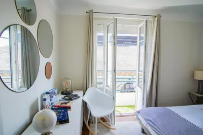Un ou plusieurs lits dans un hébergement de l'établissement -HANNAH- Joli cocon avec vue sur la ville-close