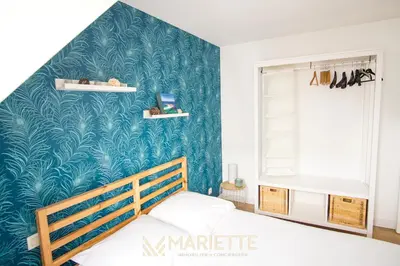 Un ou plusieurs lits dans un hébergement de l'établissement -BLUSH- Appartement cosy - proche ville-close