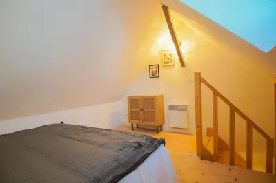 Un ou plusieurs lits dans un hébergement de l'établissement -LE CHALET- Joli cocon au centre de Concarneau