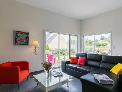 Coin salon dans l'établissement Holiday Home Terre et Mer by Interhome