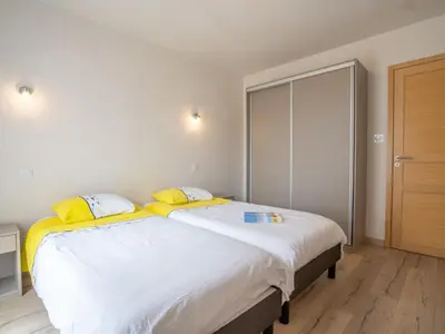 Un ou plusieurs lits dans un hébergement de l'établissement Apartment Les Chardons Bleus 1 by Interhome