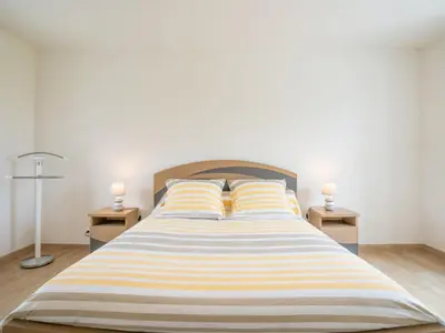 Un ou plusieurs lits dans un hébergement de l'établissement Holiday Home L'Oasis by Interhome