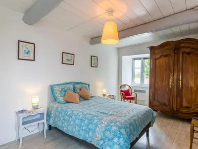 Un ou plusieurs lits dans un hébergement de l'établissement Holiday Home Le Manoir by Interhome