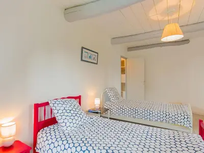 Un ou plusieurs lits dans un hébergement de l'établissement Holiday Home Le Manoir by Interhome