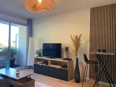 Télévision ou salle de divertissement dans l'établissement Studio Plage