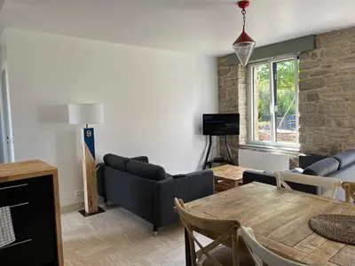 Coin salon dans l'établissement Maison bretonne typique plage des oiseaux à Fouesnant Beg Meil