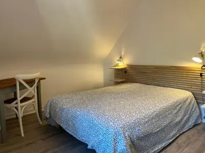 Un ou plusieurs lits dans un hébergement de l'établissement Maison bretonne typique plage des oiseaux à Fouesnant Beg Meil