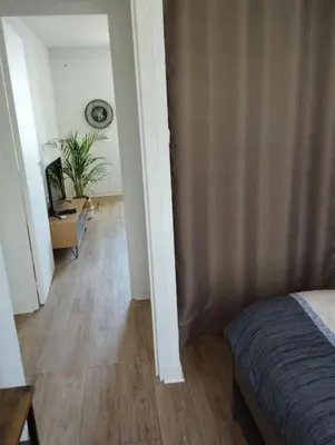 Un ou plusieurs lits dans un hébergement de l'établissement Appartement La Pérouse Vue mer et château